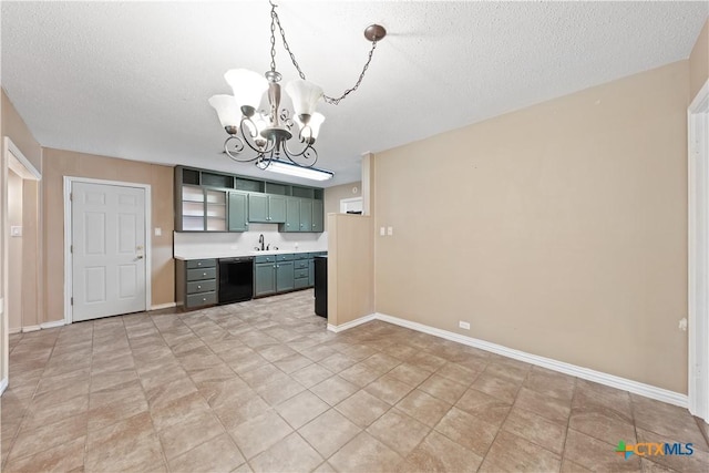 1404 N Beal St, Belton, TX 76513 - kitchen featuring dishwasher, a chandelier, a sink, light countertops, and a textured ceiling