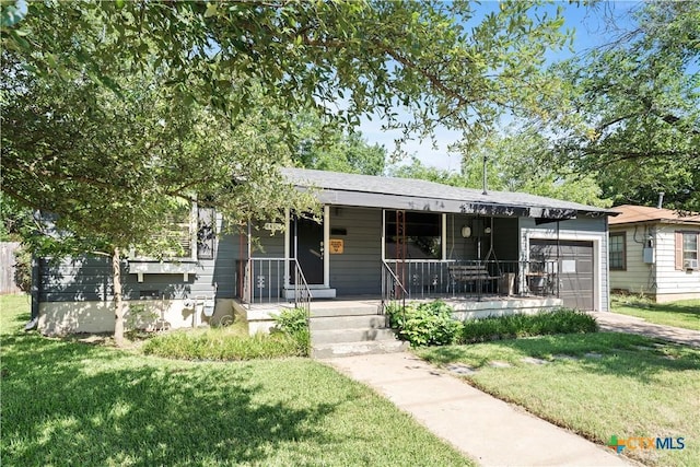 1404 N Beal St, Belton, TX 76513 - single story home with a garage, a porch, and a front yard