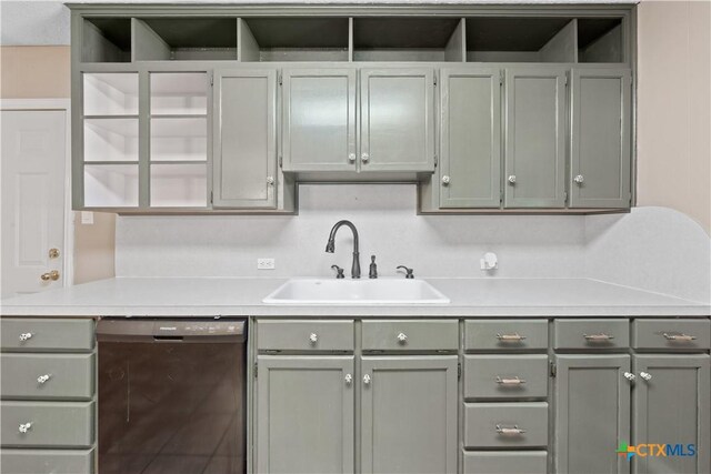 1404 N Beal St, Belton, TX 76513 - kitchen featuring black dishwasher, a sink, gray cabinets, and light countertops