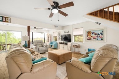 25420 Cove Dr, Spicewood, TX 78669 - living room with a wealth of natural light, wood finished floors, and a ceiling fan