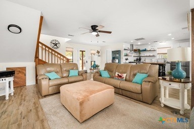 25420 Cove Dr, Spicewood, TX 78669 - living area featuring wood finished floors and ceiling fan