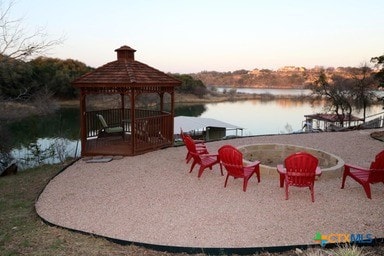 25420 Cove Dr, Spicewood, TX 78669 - dock area featuring a gazebo and a water view