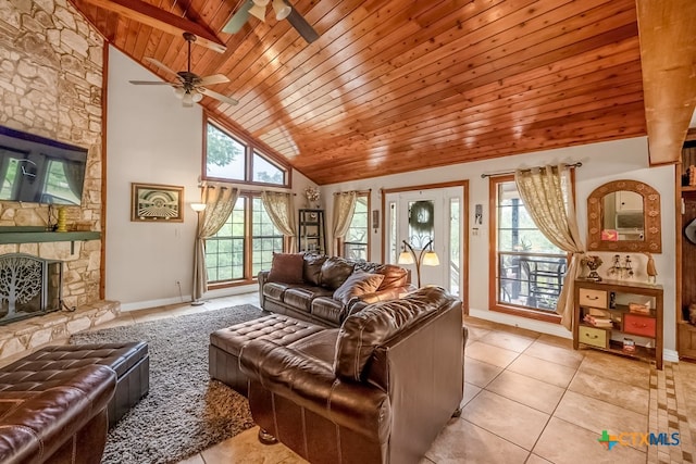 living area featuring wooden ceiling, light tile patterned floors, ceiling fan, high vaulted ceiling, and baseboards