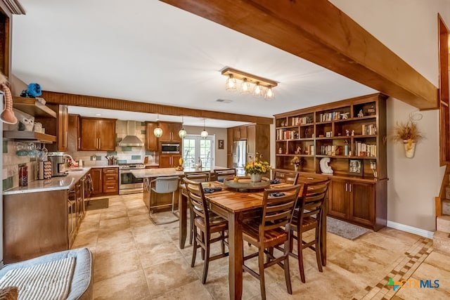dining room featuring light tile patterned flooring and visible vents