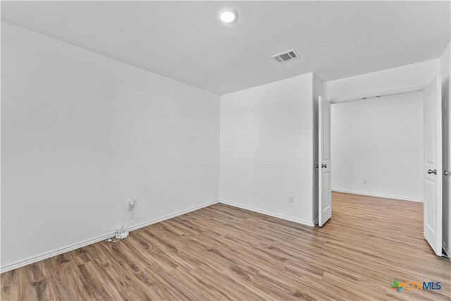 130 Carmello, Kyle, TX 78640 - unfurnished room with light wood-style flooring, baseboards, and visible vents