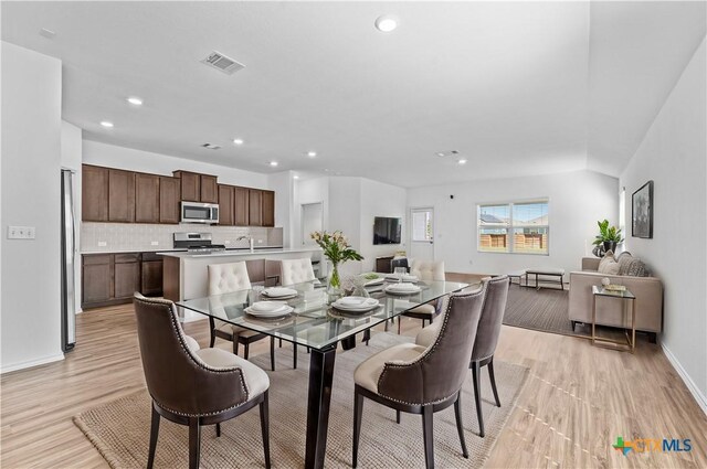 130 Carmello, Kyle, TX 78640 - dining room with baseboards, light wood-type flooring, visible vents, and recessed lighting