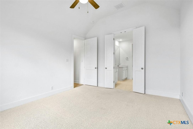 1846 Nettletree Rd, New Braunfels, TX 78132 - unfurnished bedroom featuring light colored carpet, lofted ceiling, baseboards, ensuite bath, and a ceiling fan