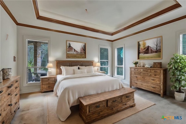 bedroom featuring multiple windows, ornamental molding, light carpet, and a tray ceiling