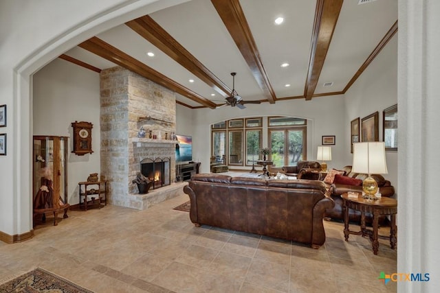 197 Falling Hls, New Braunfels, TX 78132 - living room featuring a stone fireplace, beamed ceiling, recessed lighting, crown molding, and a ceiling fan