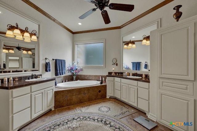 bathroom featuring vanity, tile patterned flooring, crown molding, and tiled bath