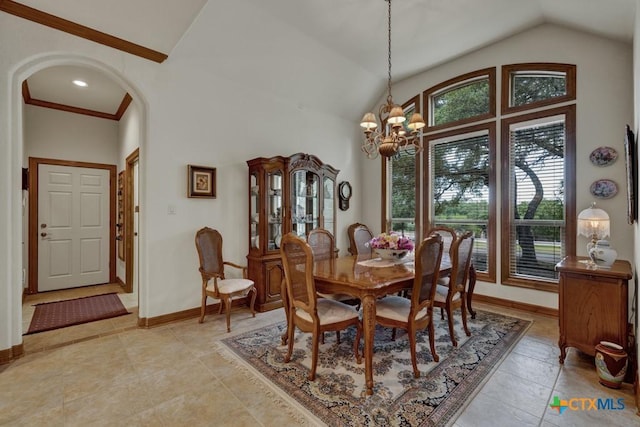 dining space with a notable chandelier and high vaulted ceiling