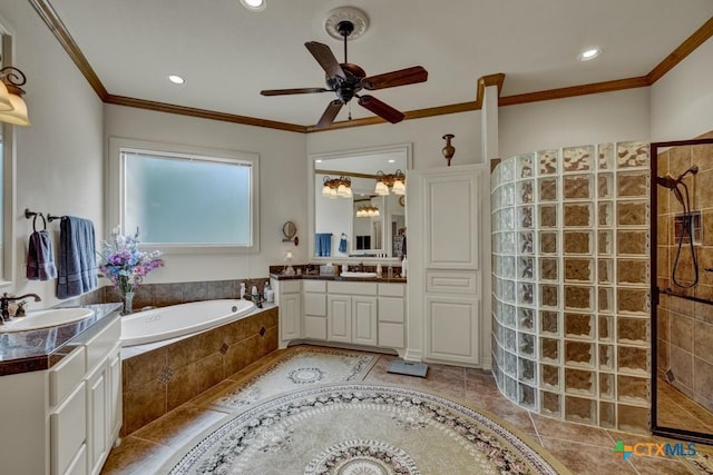 bathroom featuring plus walk in shower, ornamental molding, vanity, ceiling fan, and tile patterned floors