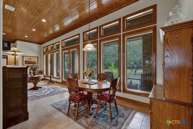 dining space featuring light tile patterned floors, wood ceiling, and ornamental molding