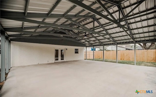 view of patio with french doors and fence