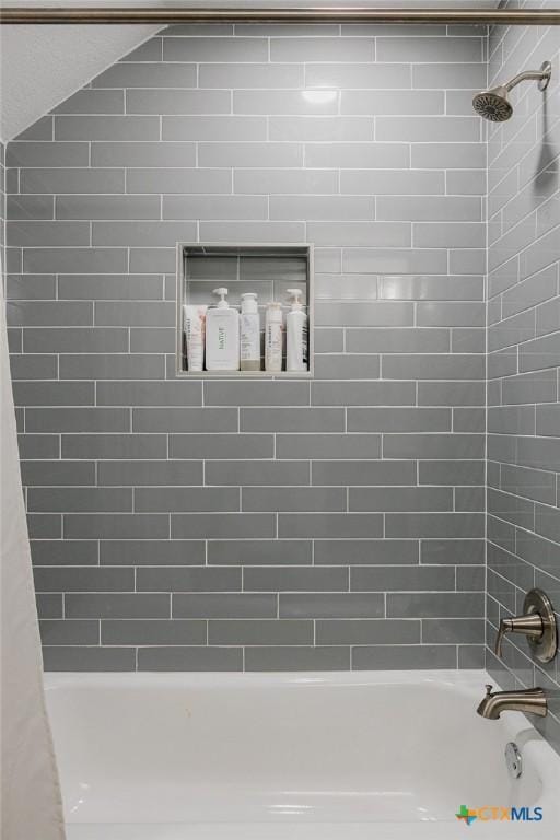 room details featuring shower / bath combination with curtain