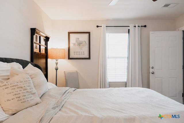 bedroom featuring ceiling fan and visible vents