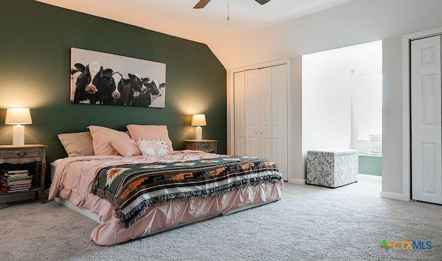 carpeted bedroom with lofted ceiling, a closet, ceiling fan, and baseboards