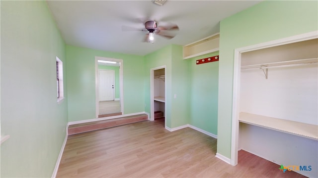 unfurnished bedroom featuring ceiling fan and light wood-type flooring