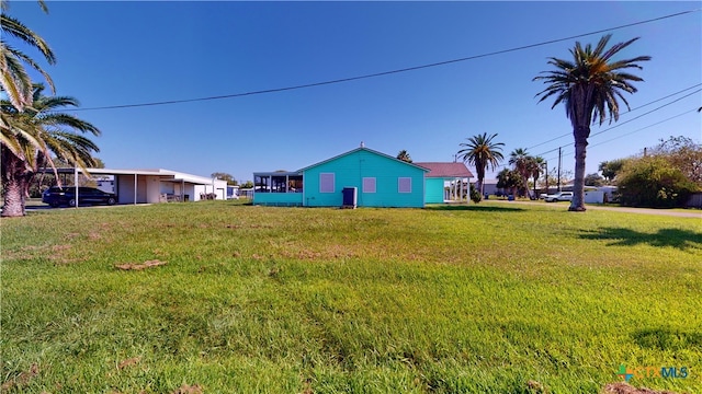 view of yard with a carport