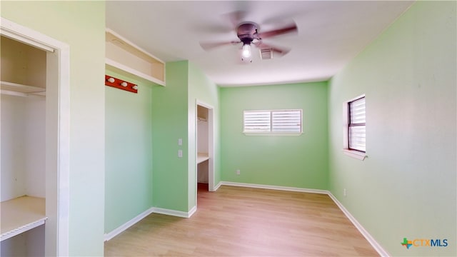 unfurnished bedroom with light hardwood / wood-style floors and ceiling fan