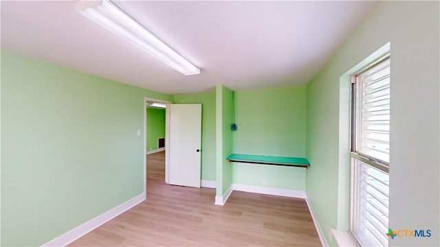 spare room featuring light hardwood / wood-style floors