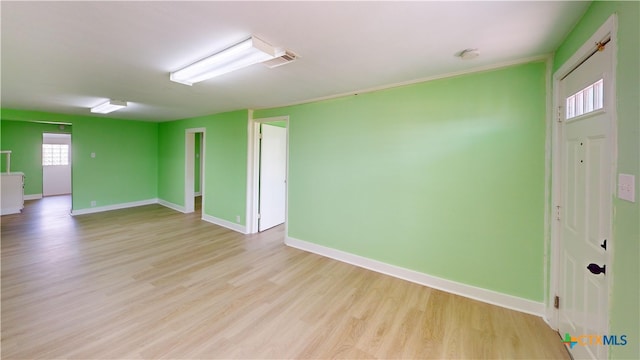 unfurnished room with light hardwood / wood-style floors