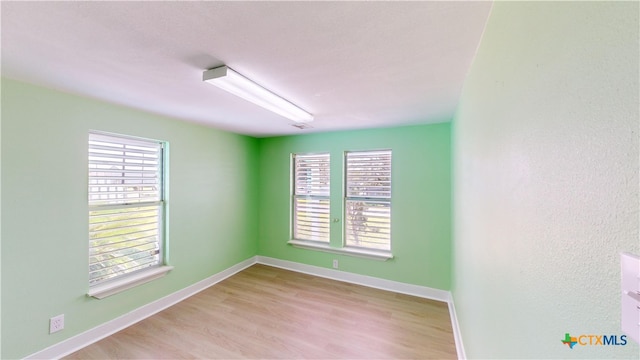 spare room featuring light wood-type flooring