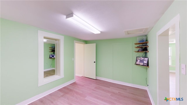 spare room with light wood-type flooring