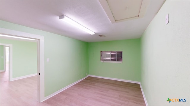 unfurnished room featuring light hardwood / wood-style floors