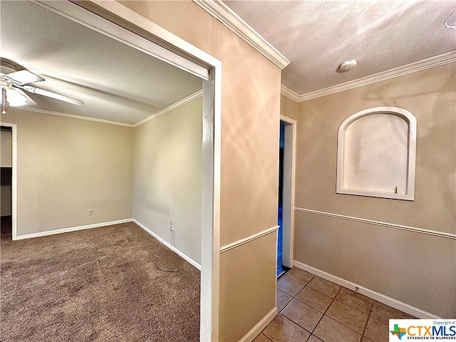 interior space featuring carpet, a textured ceiling, and ornamental molding