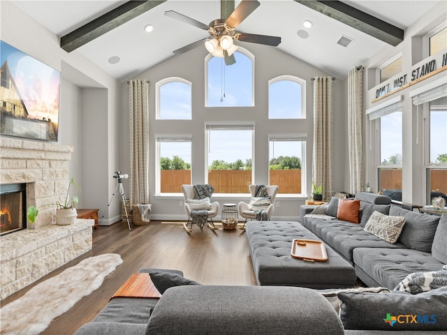 4508 River Rock Rd, Marion, TX 78124 - living area with beamed ceiling, a fireplace, ceiling fan, high vaulted ceiling, and wood finished floors