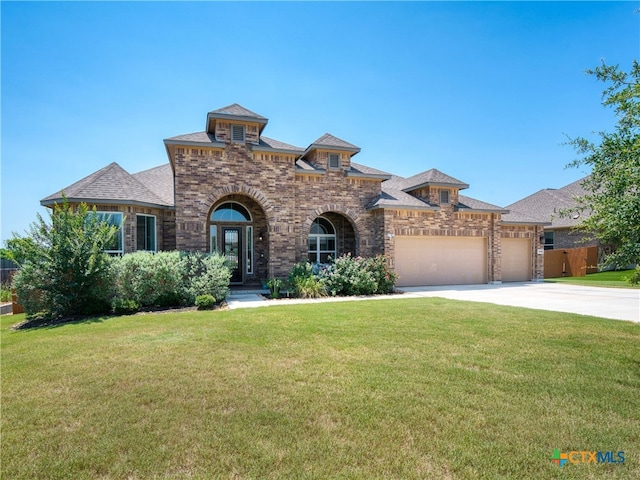 4508 River Rock Rd, Marion, TX 78124 - view of front of home featuring brick siding, a garage, concrete driveway, and roof with shingles