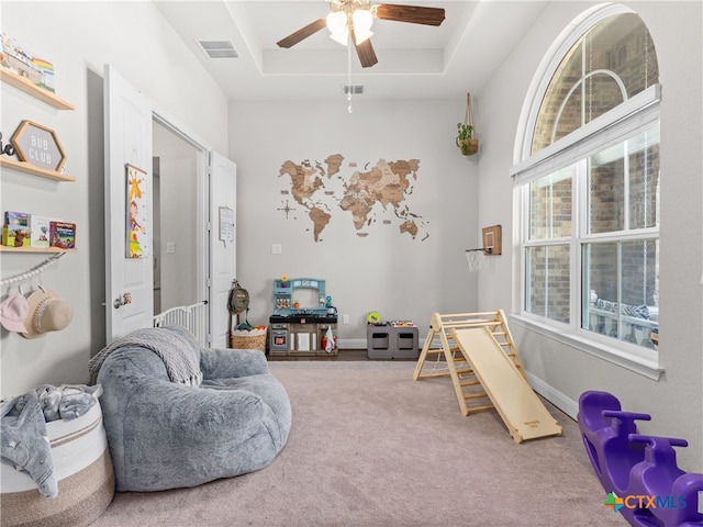4508 River Rock Rd, Marion, TX 78124 - sitting room with carpet floors, ceiling fan, a tray ceiling, and baseboards
