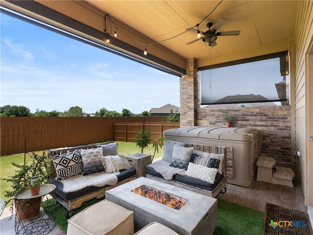 4508 River Rock Rd, Marion, TX 78124 - fenced backyard featuring a ceiling fan, an outdoor living space with a fire pit, a patio area, and a hot tub