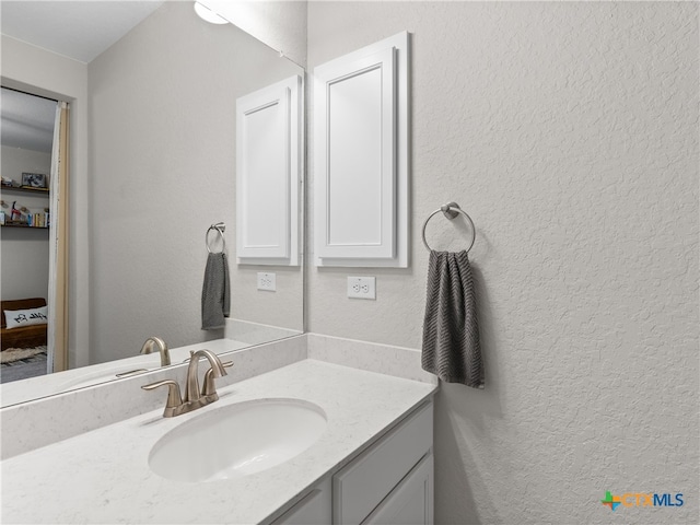 4508 River Rock Rd, Marion, TX 78124 - bathroom featuring vanity and a textured wall