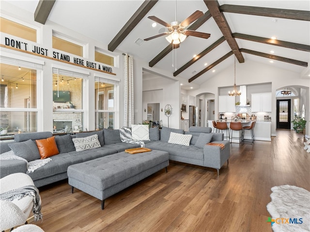4508 River Rock Rd, Marion, TX 78124 - living room featuring arched walkways, high vaulted ceiling, beam ceiling, a chandelier, and a ceiling fan