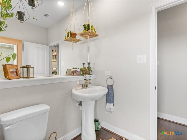 4508 River Rock Rd, Marion, TX 78124 - half bath featuring toilet, wood finished floors, and baseboards
