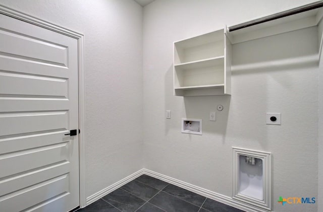 laundry area featuring electric dryer hookup, hookup for a gas dryer, dark tile patterned floors, and washer hookup