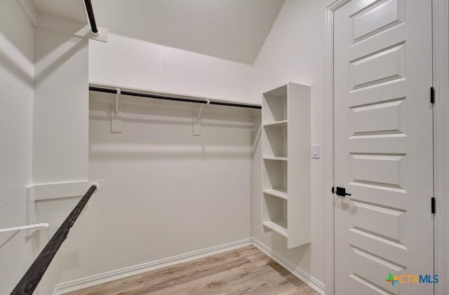 walk in closet featuring light hardwood / wood-style floors