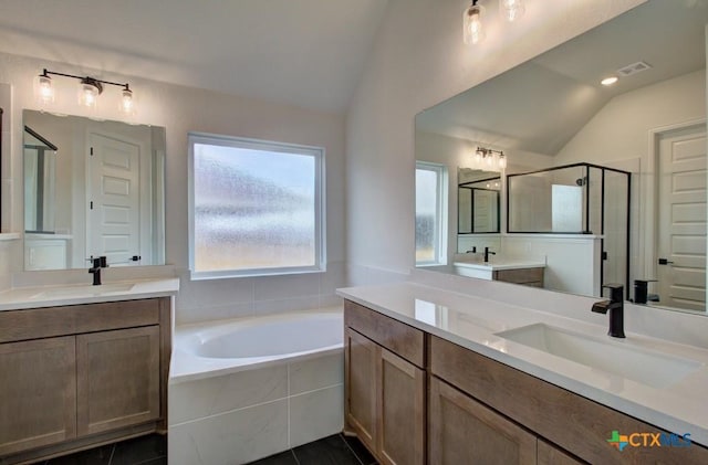 bathroom featuring separate shower and tub, tile patterned flooring, vanity, and vaulted ceiling