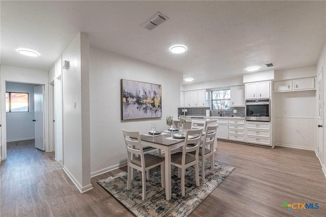 dining room featuring light wood-type flooring