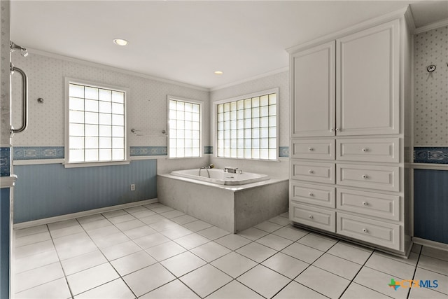 bathroom with tile patterned floors, vanity, a relaxing tiled tub, and ornamental molding