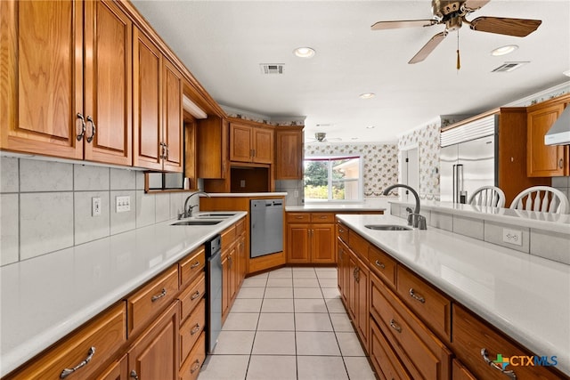 kitchen featuring ceiling fan, light tile patterned floors, sink, and stainless steel appliances