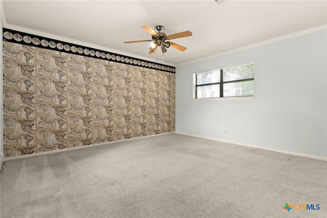 unfurnished room featuring crown molding, carpet floors, and ceiling fan