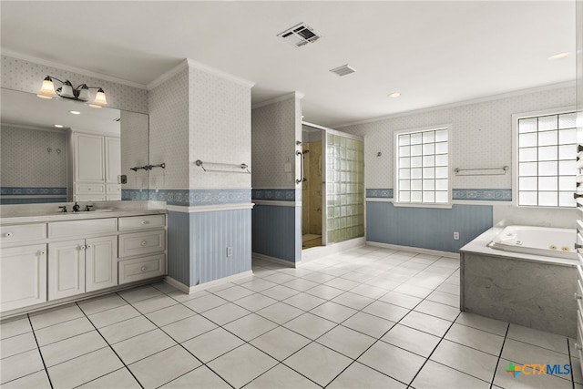 bathroom with tile patterned flooring, vanity, crown molding, and independent shower and bath