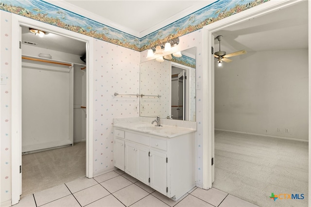 bathroom with tile patterned floors, ceiling fan, vanity, and vaulted ceiling