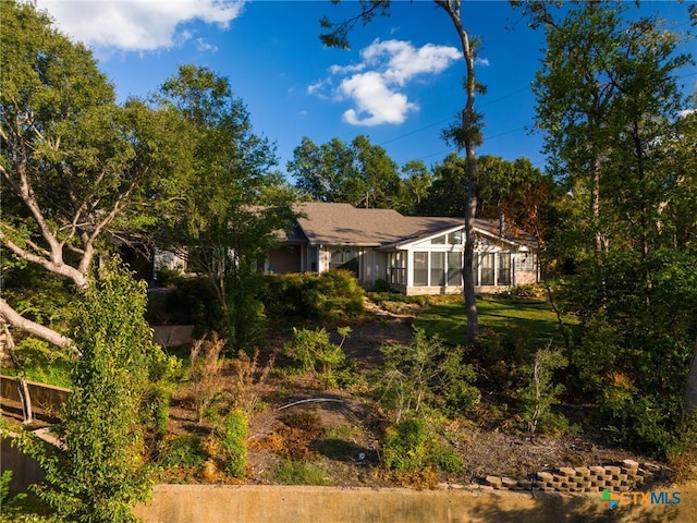 back of house with a sunroom