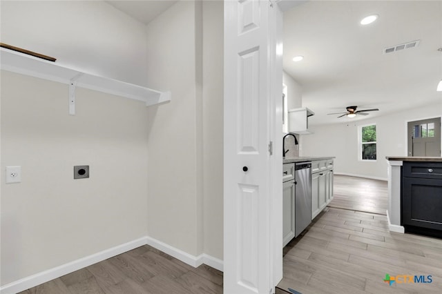 760 Lookout Dr, Canyon Lake, TX 78133 - laundry area with hookup for an electric dryer, light wood finished floors, a ceiling fan, and recessed lighting