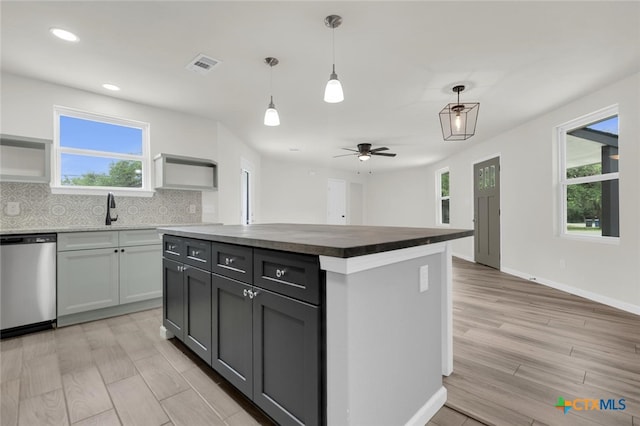 760 Lookout Dr, Canyon Lake, TX 78133 - kitchen featuring stainless steel dishwasher, tasteful backsplash, plenty of natural light, recessed lighting, and light wood-style floors