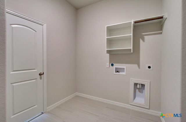 1416 Quarry Rock, New Braunfels, TX 78132 - clothes washing area featuring electric dryer hookup, hookup for a washing machine, and baseboards
